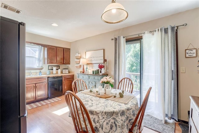 9514 W 77th Ter, Overland Park, KS 66204 - dining area with plenty of natural light and light wood finished floors