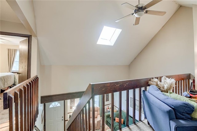 9514 W 77th Ter, Overland Park, KS 66204 - staircase featuring vaulted ceiling, a skylight, carpet floors, and a ceiling fan