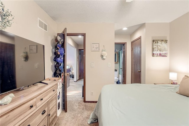 9514 W 77th Ter, Overland Park, KS 66204 - bedroom featuring light colored carpet, a textured ceiling, connected bathroom, and recessed lighting