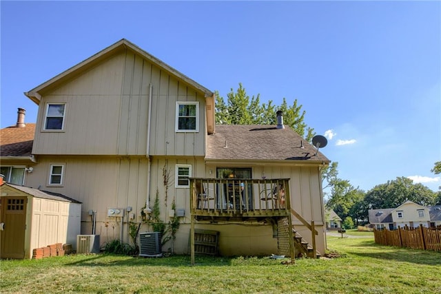 9514 W 77th Ter, Overland Park, KS 66204 - rear view of property featuring a shed, stairs, a wooden deck, a shingled roof, and board and batten siding