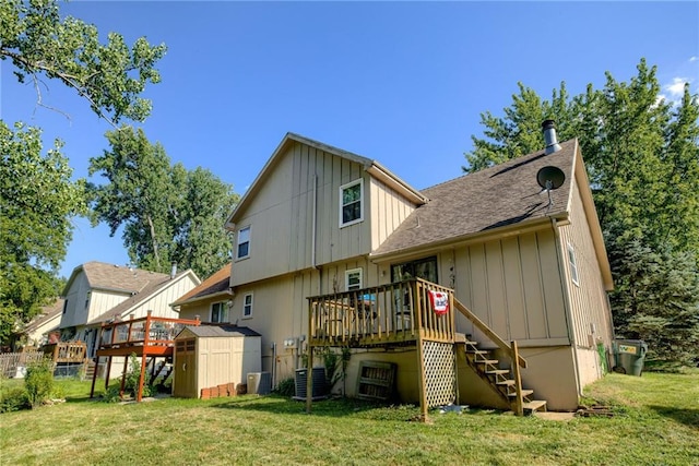 9514 W 77th Ter, Overland Park, KS 66204 - back of house with stairs, a storage shed, a wooden deck, and board and batten siding
