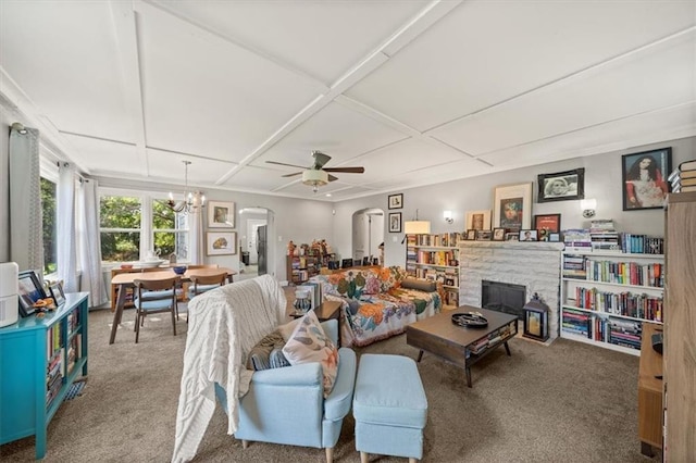 2220 N 47th St, Kansas City, KS 66104 - living room featuring arched walkways, carpet flooring, ceiling fan, a chandelier, and coffered ceiling