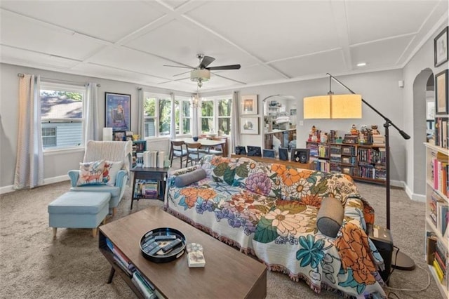 2220 N 47th St, Kansas City, KS 66104 - carpeted living room featuring ceiling fan, arched walkways, and coffered ceiling