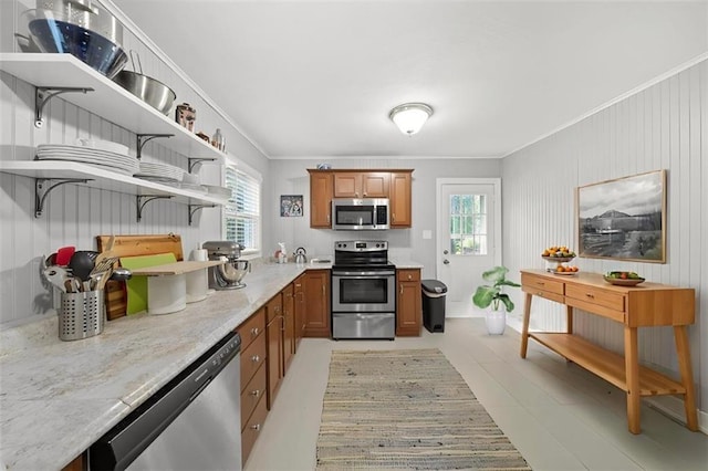 2220 N 47th St, Kansas City, KS 66104 - kitchen featuring appliances with stainless steel finishes, open shelves, brown cabinets, plenty of natural light, and ornamental molding