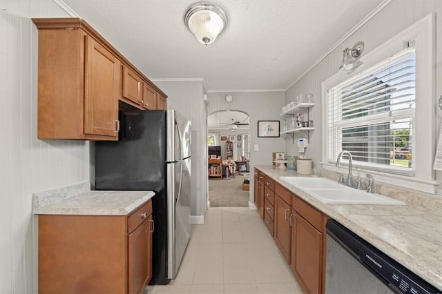 2220 N 47th St, Kansas City, KS 66104 - kitchen with appliances with stainless steel finishes, ornamental molding, brown cabinets, light countertops, and light tile patterned floors
