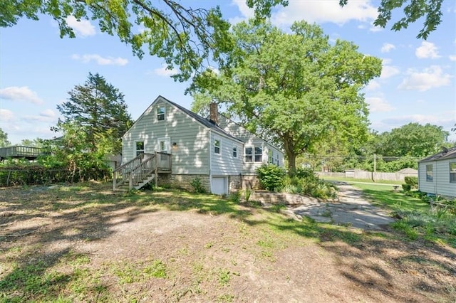 2220 N 47th St, Kansas City, KS 66104 - view of property exterior with a chimney