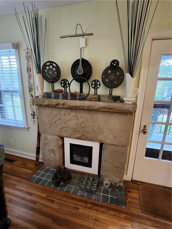 315 N 1st St, Independence, KS 67301 - detailed view of wood finished floors and a fireplace with flush hearth
