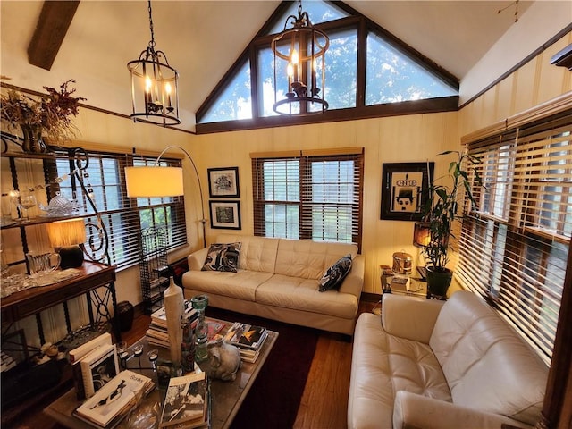 315 N 1st St, Independence, KS 67301 - living area featuring a chandelier, wood finished floors, beam ceiling, and high vaulted ceiling