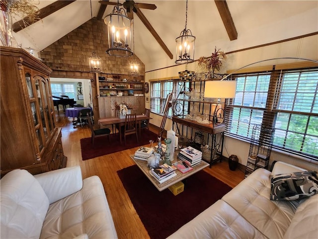 315 N 1st St, Independence, KS 67301 - living room featuring beam ceiling, high vaulted ceiling, wood finished floors, a ceiling fan, and a chandelier