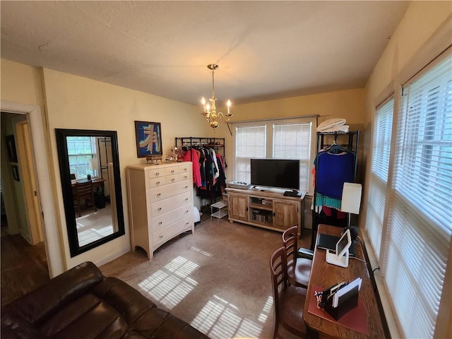 315 N 1st St, Independence, KS 67301 - living room with a chandelier and dark carpet