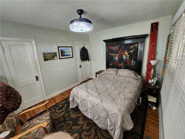 315 N 1st St, Independence, KS 67301 - bedroom featuring wood finished floors
