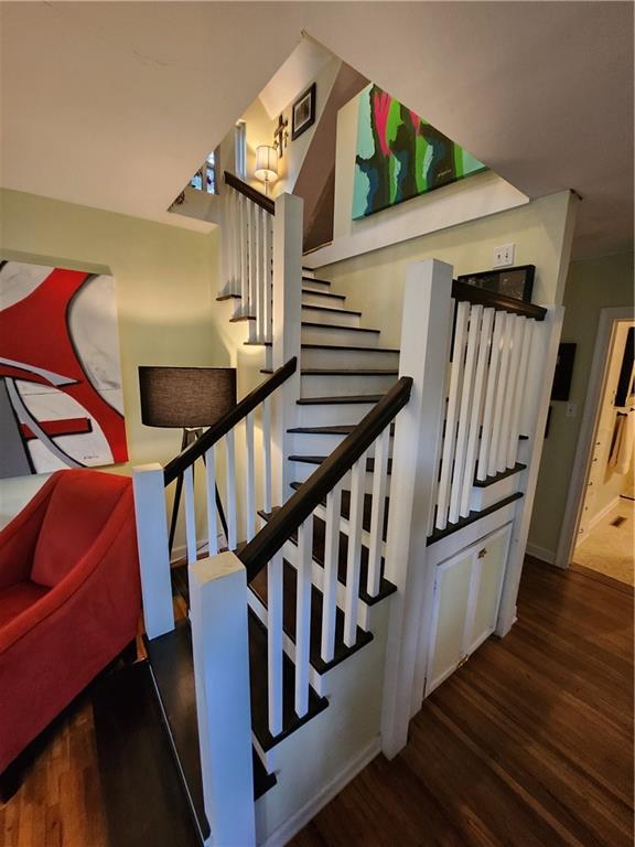 315 N 1st St, Independence, KS 67301 - stairs featuring wood finished floors and baseboards