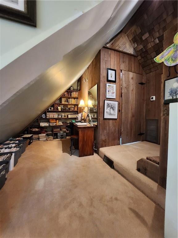 315 N 1st St, Independence, KS 67301 - additional living space featuring lofted ceiling, wood walls, a desk, and carpet