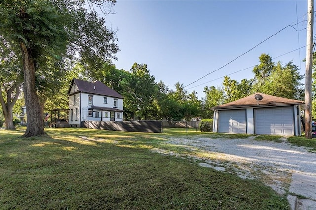 404 S Sycamore St, Ottawa, KS 66067 - view of yard with a detached garage and an outdoor structure