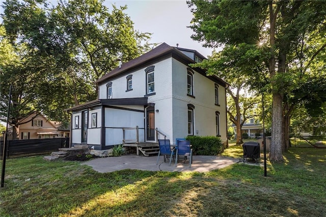 404 S Sycamore St, Ottawa, KS 66067 - rear view of house with a patio area