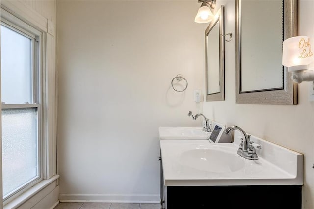 404 S Sycamore St, Ottawa, KS 66067 - bathroom with double vanity and tile patterned flooring