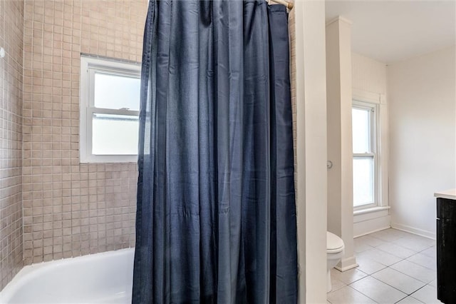 404 S Sycamore St, Ottawa, KS 66067 - bathroom featuring plenty of natural light, tile patterned floors, vanity, and shower / tub combo