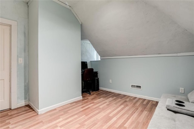 404 S Sycamore St, Ottawa, KS 66067 - unfurnished office featuring vaulted ceiling and wood finished floors