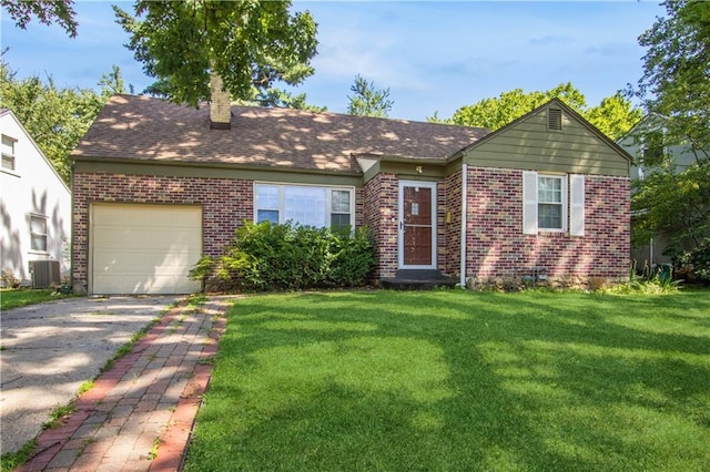 711 E 72nd Ter, Kansas City, MO 64131 - view of front facade with brick siding, an attached garage, a chimney, and a front lawn