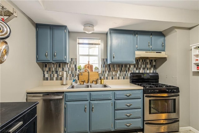 711 E 72nd Ter, Kansas City, MO 64131 - kitchen featuring stainless steel appliances, under cabinet range hood, backsplash, blue cabinetry, and light countertops