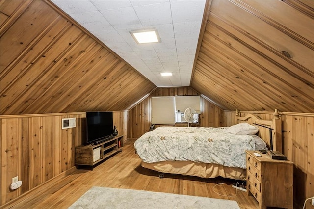 711 E 72nd Ter, Kansas City, MO 64131 - bedroom featuring wooden walls, wood finished floors, and lofted ceiling