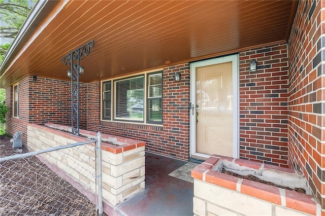 6327 Yecker Ave, Kansas City, KS 66104 - property entrance with brick siding and a porch