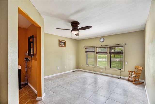 6327 Yecker Ave, Kansas City, KS 66104 - spare room featuring ceiling fan and tile patterned flooring