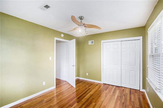 6327 Yecker Ave, Kansas City, KS 66104 - unfurnished bedroom featuring light wood finished floors, a closet, and a ceiling fan