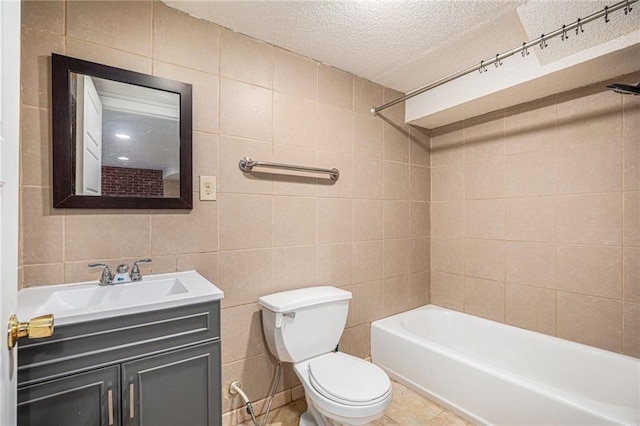 6327 Yecker Ave, Kansas City, KS 66104 - full bath with tile walls, a textured ceiling, vanity, bathing tub / shower combination, and tile patterned flooring