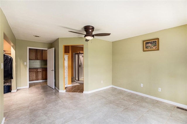 6327 Yecker Ave, Kansas City, KS 66104 - unfurnished room featuring ceiling fan and light tile patterned floors