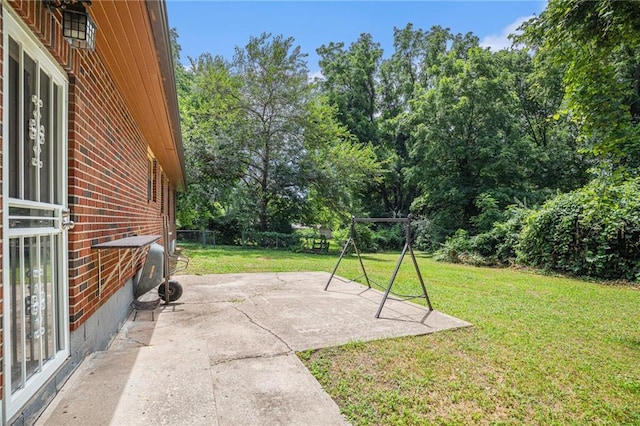 6327 Yecker Ave, Kansas City, KS 66104 - view of yard featuring a patio area and view of wooded area