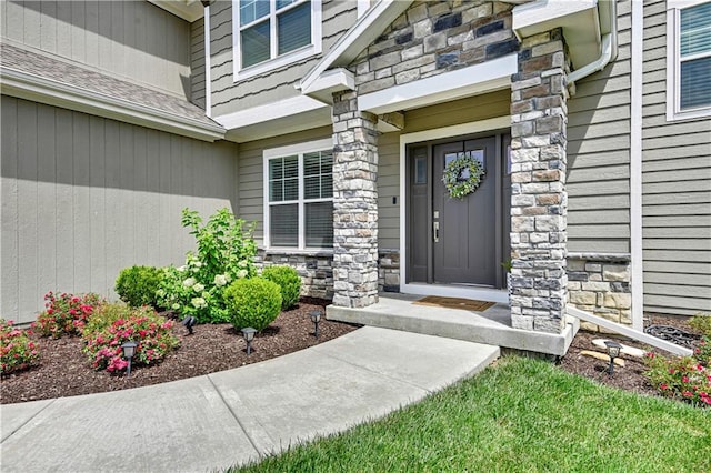 24704 W 76th St, Shawnee, KS 66227 - property entrance with stone siding and a shingled roof
