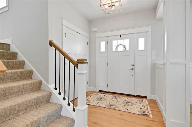 24704 W 76th St, Shawnee, KS 66227 - foyer entrance with light wood finished floors and stairs