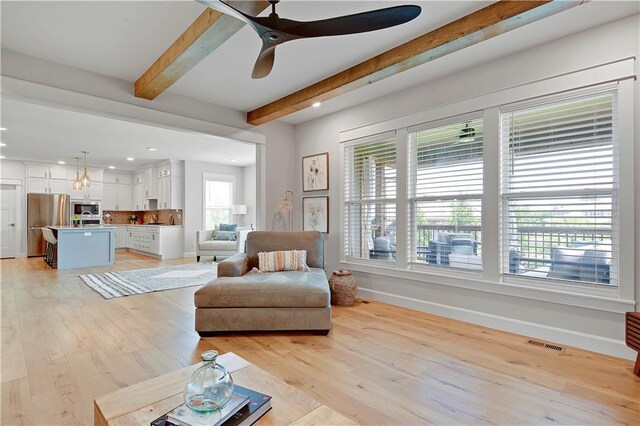 24704 W 76th St, Shawnee, KS 66227 - living area featuring beamed ceiling, light wood-style flooring, recessed lighting, and a ceiling fan
