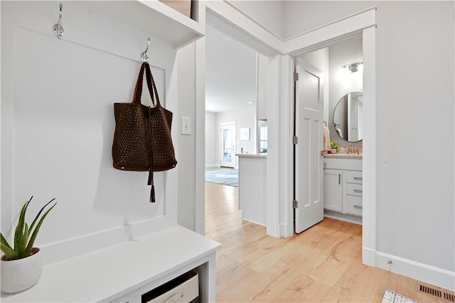 24704 W 76th St, Shawnee, KS 66227 - mudroom with light wood-style floors and a sink