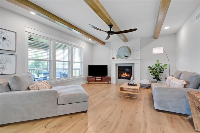 24704 W 76th St, Shawnee, KS 66227 - living room featuring beamed ceiling, ceiling fan, recessed lighting, light wood-style floors, and a fireplace