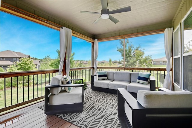 24704 W 76th St, Shawnee, KS 66227 - wooden terrace with an outdoor living space and a ceiling fan