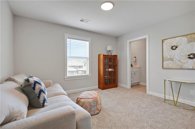 24704 W 76th St, Shawnee, KS 66227 - living area featuring baseboards and light colored carpet