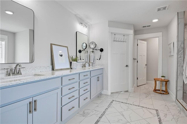 24704 W 76th St, Shawnee, KS 66227 - full bath with marble finish floors, double vanity, recessed lighting, and a shower