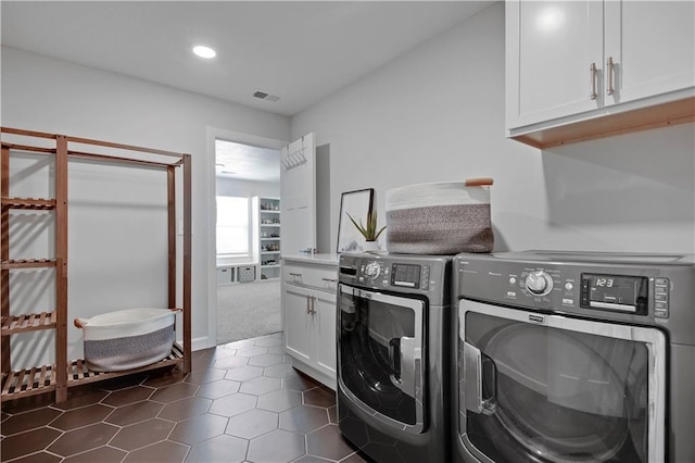 24704 W 76th St, Shawnee, KS 66227 - washroom featuring cabinet space, separate washer and dryer, dark tile patterned floors, recessed lighting, and dark colored carpet