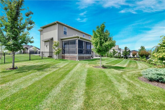 24704 W 76th St, Shawnee, KS 66227 - back of house featuring a sunroom