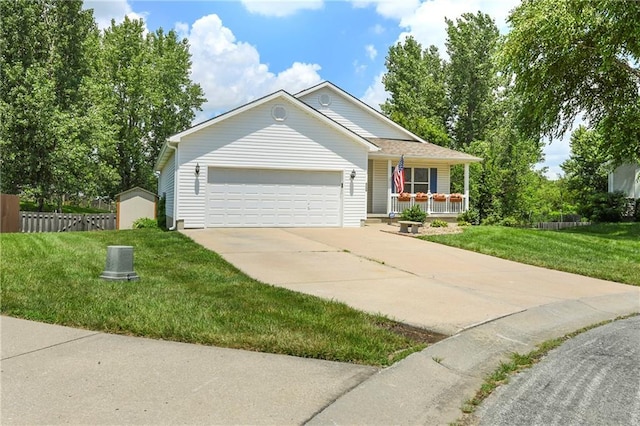 4204 Broadway Ter, Leavenworth, KS 66048 - ranch-style house with covered porch, driveway, and an attached garage