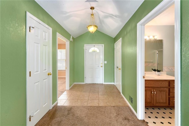 4204 Broadway Ter, Leavenworth, KS 66048 - foyer entrance featuring light colored carpet, light tile patterned floors, and lofted ceiling
