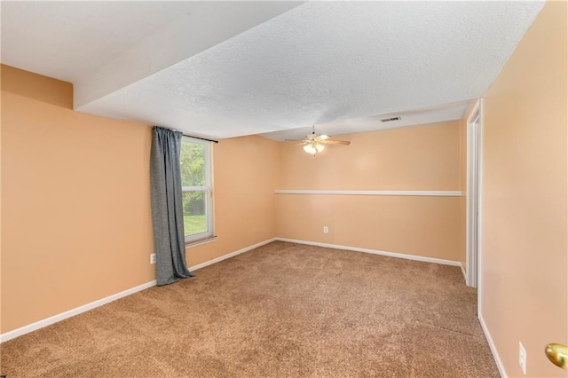 4204 Broadway Ter, Leavenworth, KS 66048 - empty room with carpet, ceiling fan, and a textured ceiling