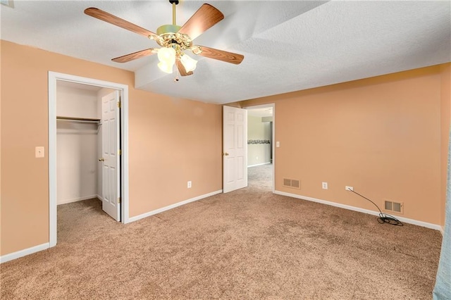 4204 Broadway Ter, Leavenworth, KS 66048 - unfurnished bedroom with carpet floors, a spacious closet, and ceiling fan