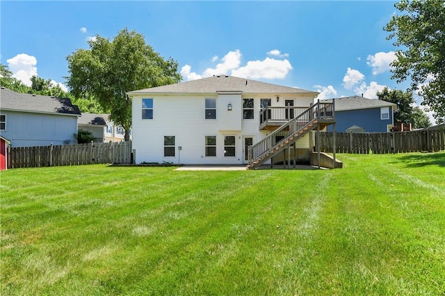 4204 Broadway Ter, Leavenworth, KS 66048 - rear view of house with stairway, a fenced backyard, a deck, and a patio