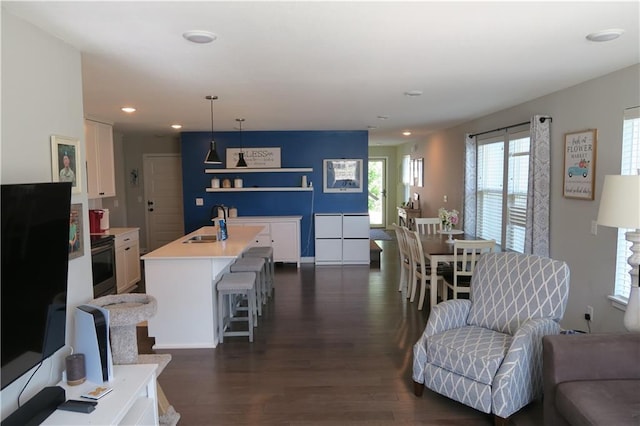 SW 8th St Unit 8819, Blue Springs, MO 64064 - living room with dark wood finished floors and recessed lighting