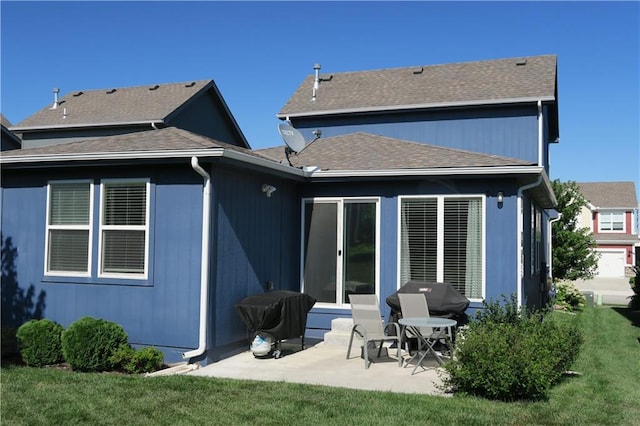 SW 8th St Unit 8819, Blue Springs, MO 64064 - rear view of property with a patio, a lawn, and a shingled roof