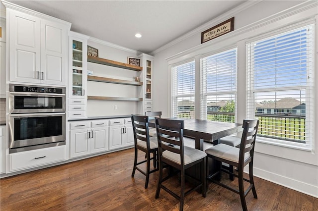 227 SW Eagles Ridge Dr, Blue Springs, MO 64014 - dining space featuring crown molding, dark wood-type flooring, and recessed lighting