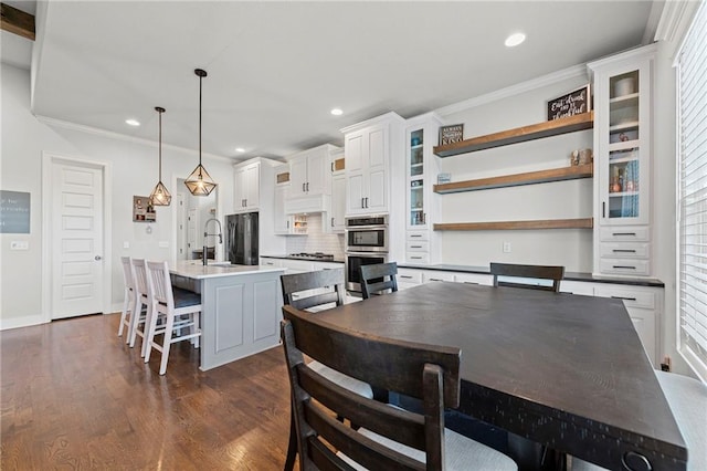 227 SW Eagles Ridge Dr, Blue Springs, MO 64014 - dining area featuring crown molding, recessed lighting, dark wood-style flooring, and plenty of natural light
